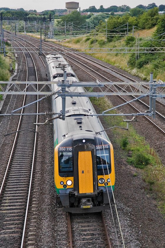 350115, LM 17.02 Crewe-London Euston, Victoria bridge 
 Passing Victoria bridge on the up fast line 350115 is seen working the 17.02 Crewe to Euston service. These services work as all station stoppers after leaving Crewe routed via Alasager and the Trent Valley line then travelling 'fast' from Rugby to London. 
 Keywords: 350115 17.02 Crewe-London Euston Victoria bridge London Midland Desiro