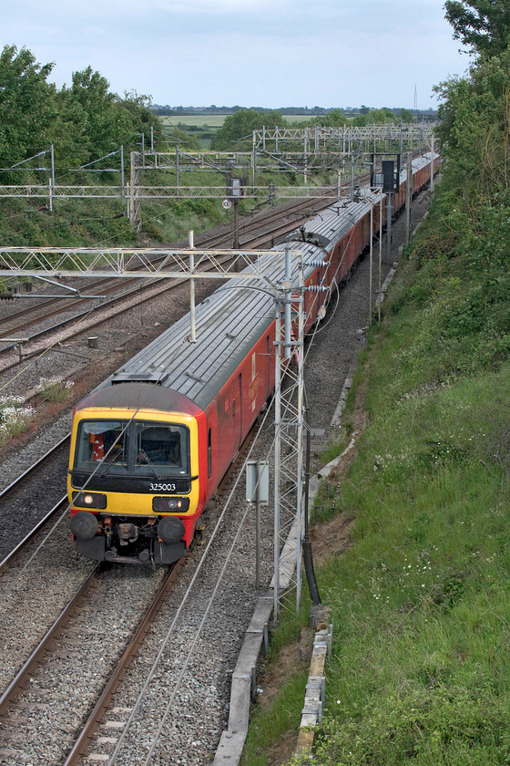 325003, 325009 & 325012, 16.21 Willesden PRDC-Shieldmuir (1S96, 4E), Victoria bridge 
 The daily Royal Mail 1S96 passes Victoria bridge between Roade and Hanslope Junction. Today, the train that leaves the Park Royal mail depot at 16.21 heading for Scotland was composed of 325003, 325009 and 325012. These units have a very distinctive sound being based on the noisy Class 319 units with their screaming traction motors. 
 Keywords: 325003 325009 325012 16.21 Willesden PRDC-Shieldmuir 1S96 Victoria bridge Royal Mail