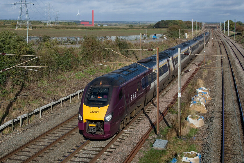 222001, EM 09.29 Sheffield-London St. Pancras (1B32, 22L), Park Road bridge TL020390 
 Get your photographs of the Class 222 Meridians whilst you can! All are scheduled to be returned to Eversholt sometime in the not-too-distant future once Class 810s replace them on EMR Intercity services. Pioneer 222001, introduced in May 2004, passes the isolated Park Road bridge between Bedford and Flitwick working the 1B32 09.29 Sheffield to St. Pancras fast service. 
 Keywords: 222001 09.29 Sheffield-London St. Pancras 1B32 Park Road bridge TL020390EMR Meridian