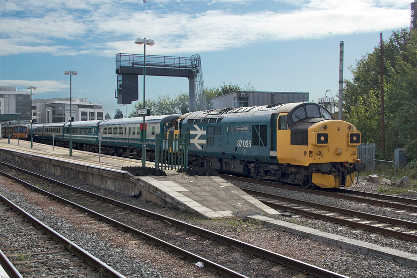 37025, 09.51 Rhymney-Cardiff Canton sidings ECS (5F10), Cardiff Central station 
 Unfortunately, this was a working that caught me out so the lighting is pretty awful taken looking into the sun with my side of the train in deep shadow. The locals on Central station got very excited on hearing the arrival of 37025 at this time in the morning, by now it should have been safely ensconced on Canton depot. Apparently, a unit had failed earlier in the morning so 37025 and 37418 (out of sight on the rear) were called upon to work an additional service to Rhymney. It then ran back as the 09.51 empty coaching stock 5F10 to Canton with a brief pause at Central station. 
 Keywords: 37025 09.51 Rhymney-Cardiff Canton sidings ECS 5F10 Cardiff Central station