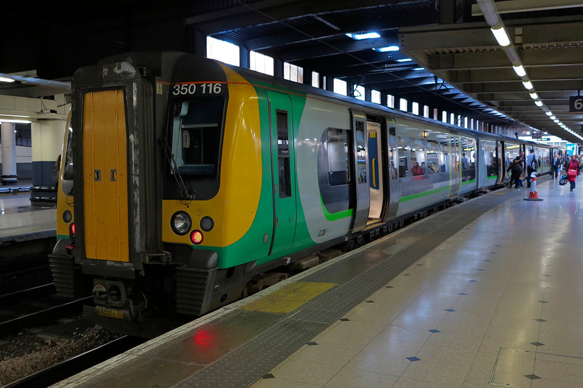 350116, LN 19.49 London Euston-BNS (1Y79, 1L), London Euston station 
 Our train home from London Euston, the 19.49 to Birmingham New Street waits at platform 6. This is always a busy train and always a 4-car unit meaning that on leaving Euston it is consistently full and standing very often with first class decalcified by the guard. 
 Keywords: 350116 1Y79 London Euston station