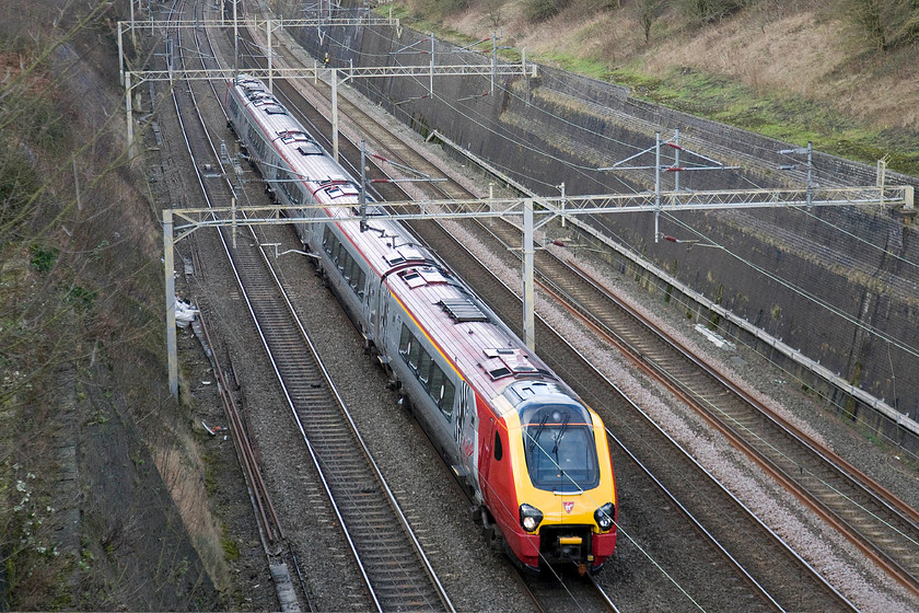 Class 221, VT 10.17 Preston-London Euston (9M51), Roade Cutting 
 A class 221 heads south through the glorious Roade cutting working the Virgin 10.17 Preston to London Euston 9M51 service. Looking at the shiny paintwork, it looks as if this particular Voyager has been in the paint shop recently. 
 Keywords: Class 221 10.17 Preston-London Euston 9M51 Roade Cutting