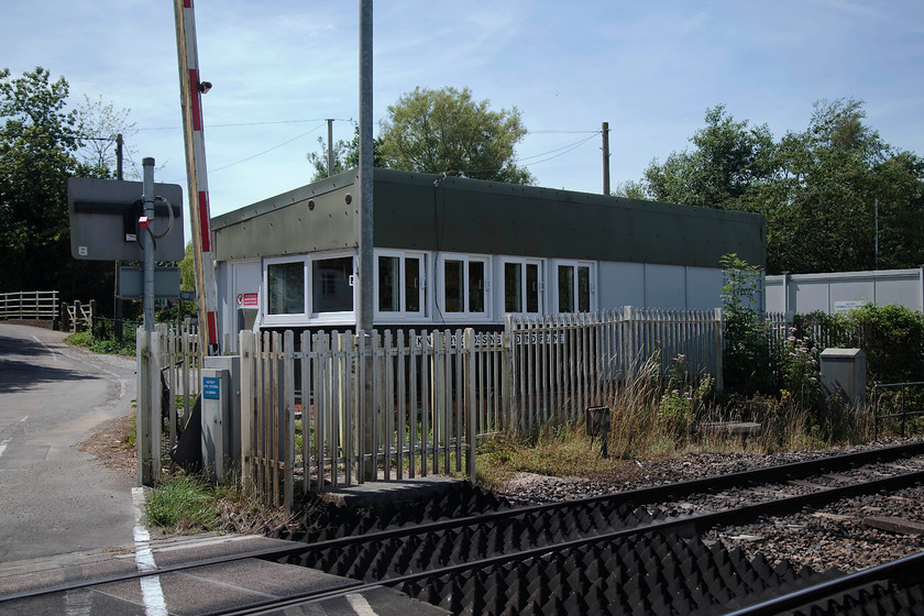 Kintbury Crossing Ground Frame box (BR, 1978) 
 I visited Kintbury on the day the that the semaphore signalling was decommissioned in April 1978. Then, I was permitted access to the GW box situated immediately to my right here. This is the BR monstrosity that replaced it! It controls the three level crossings in the area west of Newbury, Hamstead, Kintbury and Hungerford. 
 Keywords: Kintbury Crossing Ground Frame box