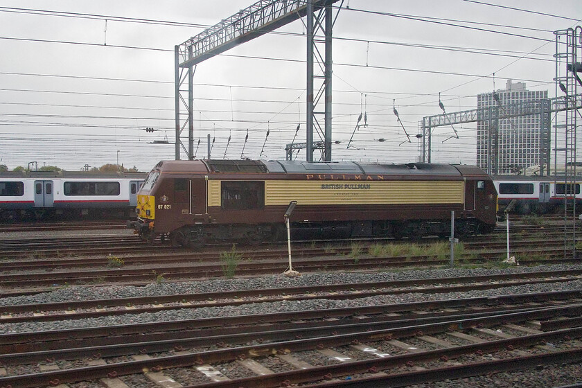 67021, stabled, Wembley Yard 
 I have plenty of photographs of 67021 but opportunities to capture members of the under-utilised class (now much reduced in size) are getting more and more rare. With lines of warm-stored former Great Eastern Class 321s behind the dedicated Belmond British Pullman locomotive is seen on a gloomy November day. 
 Keywords: 67021 stabled Wembley Yard Belmond British Pullman