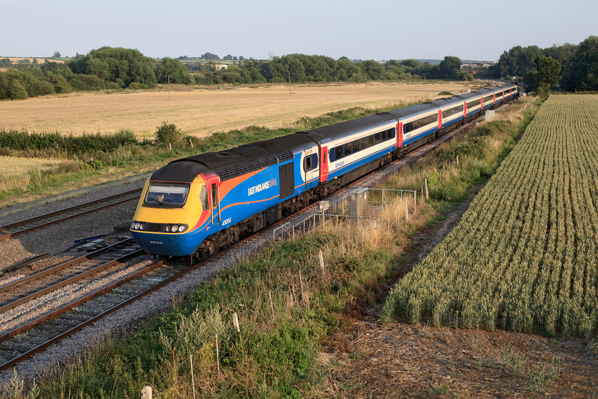 43054 & 43089, EM 18.25 London St. Pancras-Sheffield (1F63, 6L), Harrowden Junction 
 43054 leads with 43089 at the rear of the 18.25 St. Pancras to Sheffield. It is seen between Wellingborough and Kettering at Harrowden Junction on a glorious summer's evening. I know how I would prefer to make this journey given the choice of an HST or a Meridian! 
 Keywords: 43054 43089 1F63 Harrowden Junction