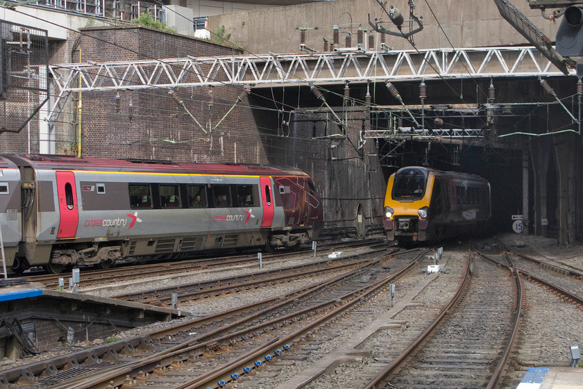 221123, XC 14.27 Manchester Piccadilly-Bournemouth (1022) & 221004, XC 08.20 Aberdeen-Penzance (1V60), Birmingham New Street station 
 A meeting of CrossCountry services at Birmingham New Street. To the left, 221123 works the 1O22 14.27 Manchester Piccadilly to Bournemouth and leaves heading southwards toward its next stop at Birmingham International. To the right, the 1V60 08.20 Aberdeen to Penzance arrives being worked by 221104. 
 Keywords: 221123 14.27 Manchester Piccadilly-Bournemouth 1022 221004 08.20 Aberdeen-Penzance 1V60 Birmingham New Street station Cross Country Voyager