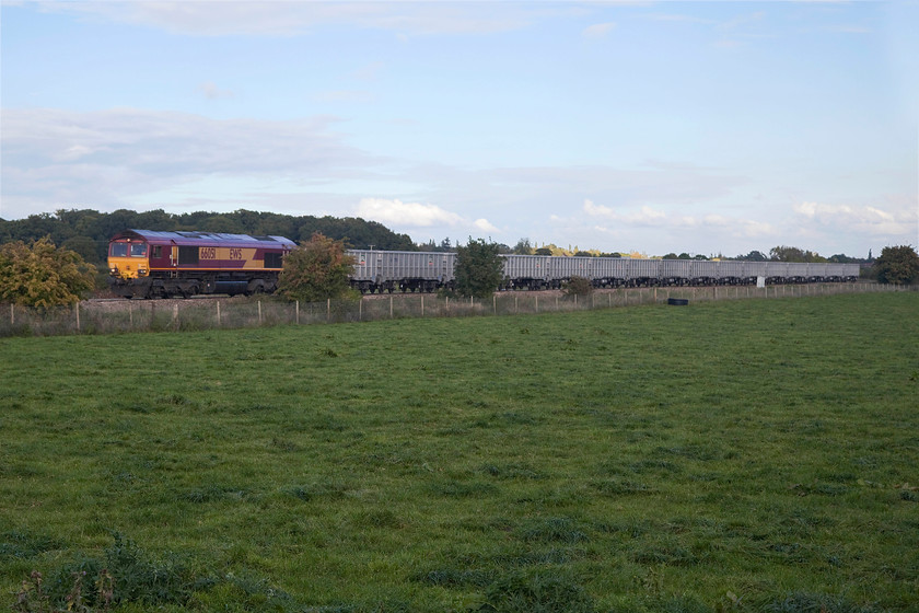 66051, 13.03 Fareham A.R.C. sidings-Whatley (6V16), Berkley ST808497 
 The 13.03 Fareham ARC to Whatley Quarry empty stone train approaches Berkley near Frome with 66051 leading the train. This has been routed via Salisbury to Westbury. Here, the engine ran round and it completed its journey, the short distance to Whatley via Frome. Unfortunately, its passage coincided with the sun diving behind some troublesome cloud that had blown in behind me from the south. 
 Keywords: 66051 13.03 Fareham A.R.C. sidings-Whatley 6V16 Berkley ST808497