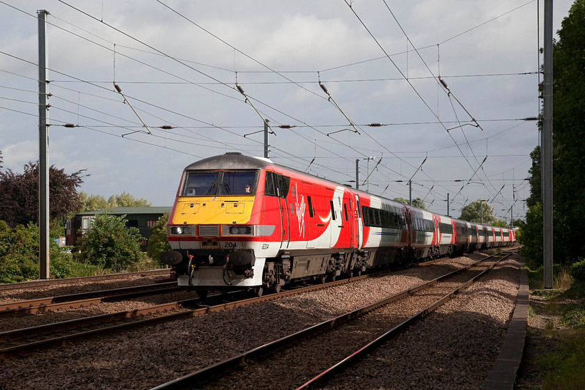 82204 & 91120, GR 05.50 Edinburgh Waverley-London Kings Cross (1E01, 1L), Gills Crossing 
 Catching a welcome patch of sunshine, 82204 with 91120 pushing at the rear pass Offord Cuny's Gill's Crossing with the 1E01 05.50 Newcastle to London King's Cross. It's a shame that the sun did not last with the rest of the morning being dull and overcast. 
 Keywords: 82204 91120 1E01 Gills Crossing