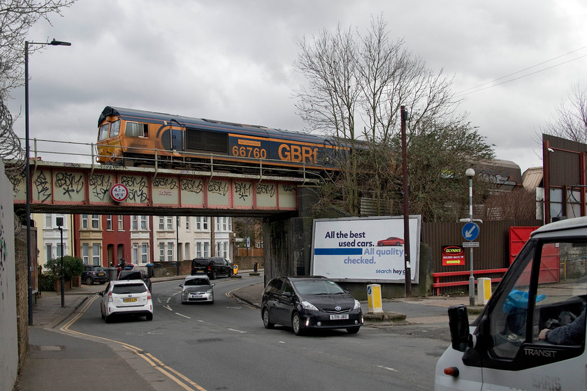 66760, 12.04 Angerstein Wharf-Bardon Hill (6M75, 5L), Neasden Lane bridge TQ215851 
 RTT had indicated that there was a freight due along the short freight only line that links Acton Wells Junction to the MML at Brent Yard. Being in the middle of north-west London there was nowhere particularly photogenic to capture it. So, we waited by Neasden Lane bridge for it to cross in front of us being in receipt of some strange looks from the normals going about their business! I actually quite like this image of 66740 'David Gordon Harris' leading the 12.04 Angerstein Wharf to Bardon Hill stone empties. However, it's a shame that the loco does not quite fit fully on the bridge, being partially obscured by some saplings. 
 Keywords: 66760 David Gordon Harris 12.04 Angerstein Wharf-Bardon Hill (6M75, 5L), Neasden Lane bridge TQ215851 GBRf