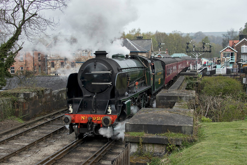 926, NY 10.00 Whitby-Pickering (1T11, 60E), Grosmont station 
 926 'Repton' makes a steady and determined start from Grosmont seen from their viewing platform between the station and the tunnel. It's a steady and fairly steep climb from Grosmont up to Goathland but the 25,130 lbf of tractive effort of the 1934 built school should be well up to the job! 
 Keywords: 926 10.00 Whitby-Pickering 1T11 Grosmont station