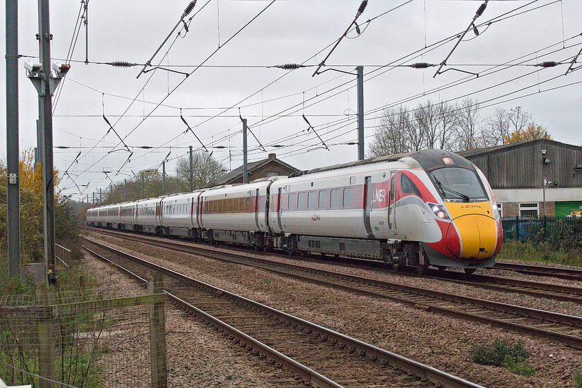 801230, GR 08.00 London King's Cross-Edinburgh Waverley (1S07, RT), Tempsford level crossing 
 The 08.00 King's Cross to Edinburgh Azuma service passes Tempsford level crossing on this very dull November morning. 
 Keywords: 801230 08.00 London King's Cross-Edinburgh Waverley 1S07 Tempsford level crossing LNER Azuma