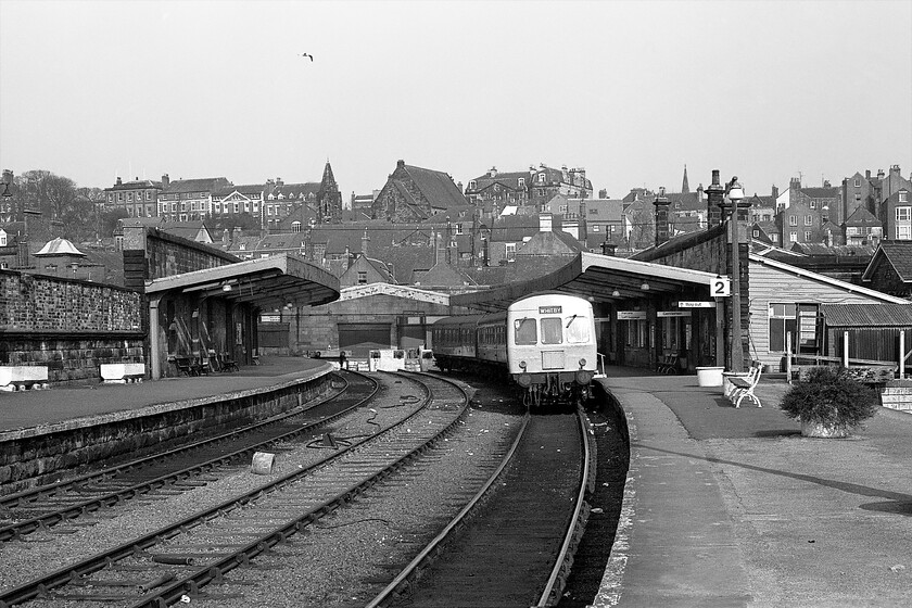 Class 101 DMU, unidentified working, Whitby station 
 To take this photograph I was standing on platform two which was to close within a couple of years when a huge rationalisation of the trackwork in and around Whitby was to take place. All traffic was to be moved to platform one with platform two truncated at the end of the building. However, in better times the platform was reinstated, lengthened and straightened out to become the charter platform seeing daily summer services extended from the North Yorkshire Moors Grosmont station. In this 1981 scene, the three-car Class 101 DMU will depart heading along the delightful and winding Esk Valley route to Middlesborough and possibly then on to Darlington. 
 Keywords: Class 101 DMU unidentified working Whitby station First generation DMU