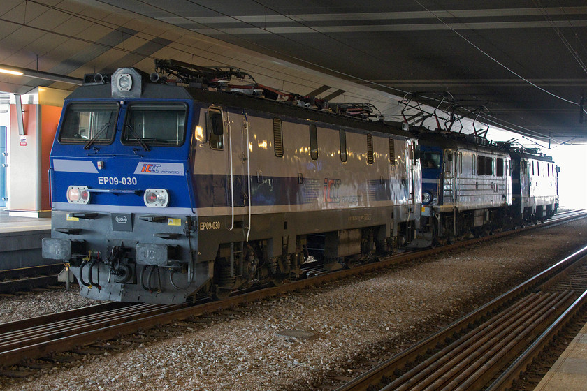 EP09-002, EU07-331 & EP09-030, stabled, Krakw Glwny station 
 There is always plenty of stabled locomotives to be seen around Krakw's Glwny due to it being the terminating and the starting point for InterCity services to Warszawa and other places throughout Poland that are not operated by PKP's Pendolino fleet. In one of the station's centre roads, two EP09s box in an older Class EP07. EP09-002 and EP09-030 are two of a forty-seven strong class whilst EU07-331 is one of a far more numerous class of some four hundred and forty-eight locomotives. With their ribbed sides, the Class 07s look to be a more dated design (1965 onwards) than the more modern slab-sided Class 09s (1990s). 
 Keywords: EP09-002 EU07-331 EP09-030 stabled Krakw Glwny station PKP Railways Epoka The Epoch Anglik The Englishman