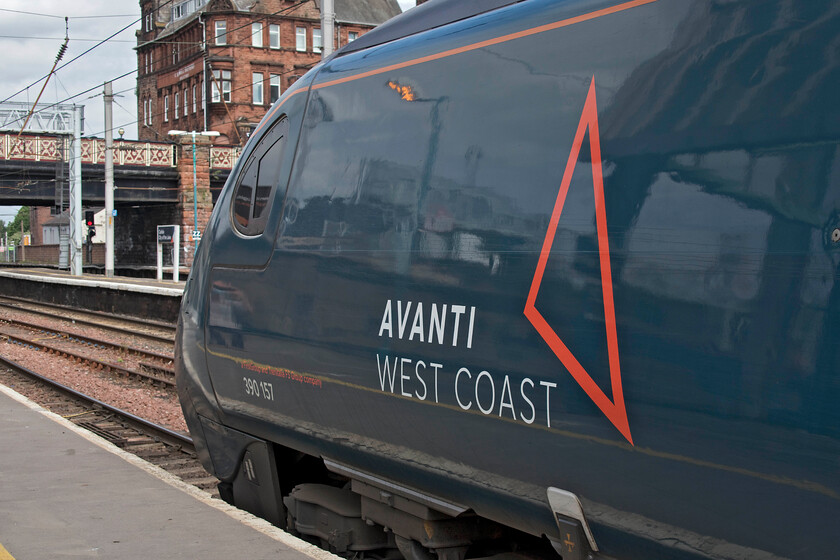 390157, VT 07.10 London Euston-Glasgow Central (1S42, 4E), Carlisle station 
 390157 'Chad Varah' whisked Andy and me from Crewe to Carlisle working the 1S42 07.10 Euston to Glasgow Avanti West Coast service. The train is seen getting away from Carlisle station bang on time. The trains are now very nearly twenty years old and they remain comfortable and supremely reliable. The only issue that they still have issues with is the smelly waste tanks that were doing what they have always done on this train, stinking out the vestibules! 
 Keywords: 390157 07.10 London Euston-Glasgow Central 1S42 Carlisle station Avanti West Coast Pendolino Chad Varah