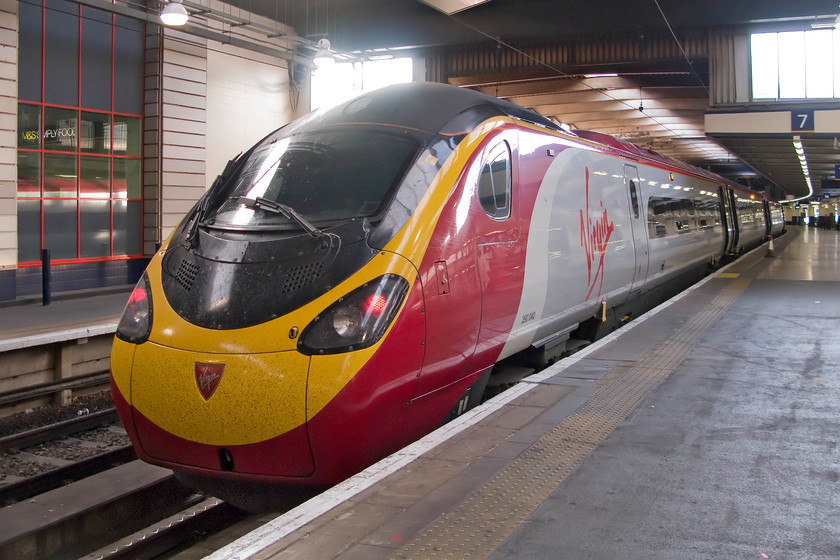 390040, VT 18.57 London Euston-Manchester Piccadilly (1H83), London Euston station 
 390040 waits at Euston's platform seven to leave with the 1H83 18.57 to Manchester Piccadilly. On a warm summer's evening, Euston is a tolerable station to be at when the strong outside light manages to permeate down to platform level. During most other times, it remains pretty dismal. 
 Keywords: 390040 18.57 London Euston-Manchester Piccadilly 1H83 London Euston station virgin train