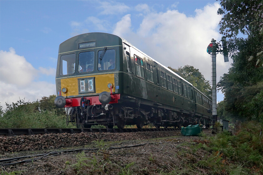 M51188 & M56182, Sheringham-Holt ECS, Weybourne woods-15.10.23 
 I have visited the North Norfolk Railway many times over the years when on holiday at Kelling Heath and have noted the various adjustments that they make to their working timetable year by year. This season, the green timetable (their minimum service patern) has a morning empty coaching stock working from Sheringham to Holt. I was not aware of this and on making my way down to Weybourne station was caught out by the sound of one of their resident DMUs leaving the station. Luckily, I was on a path close to the line so managed this photograph of M51188 leading their recently restored M56182 
 Keywords: M51188 M56182 Sheringham-Holt ECS Weybourne woods First generation DMU cla 101