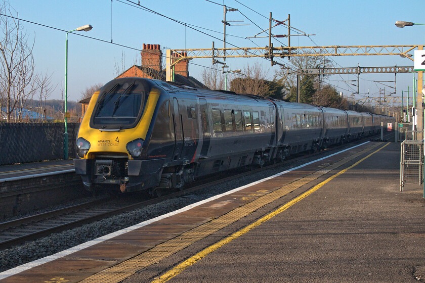 221104 & 221110, VT 15.02 London Euston-Holyhead (1D89, 1E), Kings Langley station 
 Much as I dislike the Voyagers I make a point of photographing when they pass as they only have a few months left in service on the WCML. Taken the wrong side of the sun 221104 and 221110 passes at speed on the down fast line at Kings Langley with the 1D89 15.02 Euston to Holyhead service. 
 Keywords: 221104 221110 15.02 London Euston-Holyhead 1D89 Kings Langley station Avanti West Coast Voayger