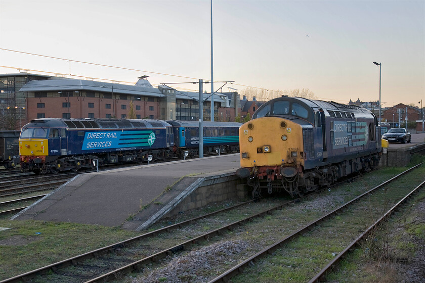 47818 & 37604, stabled, Norwich Yard 
 With the sun having set the light levels are falling but there is a certain autumnal warmth to the photograph here at Norwich. 47818 and 37604 are seen in the yard with their services and operations for the day now done assisting Abellio Greater Anglia with their shortage of units. I hope that the passengers travelling to and from Lowestoft and Great Yarmouth appreciate the luxury of Mk. II air-conditioned stock and the sound from a proper locomotive up the front as much as the enthusiasts do! 
 Keywords: 47818 37604 Norwich Yard DRS Direct Rail Services