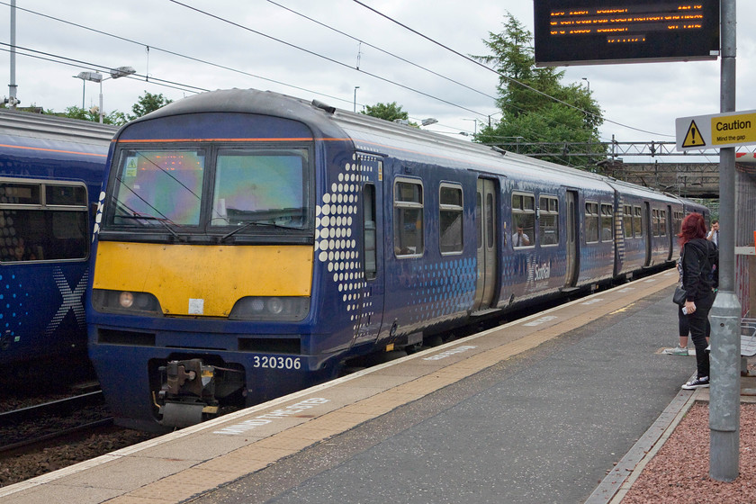 320306, SR 11.46 Airdrie-Balloch (2E73, 8L), Dalmuir station 
 Andy and I took this train, the 11.46 Aidrie to Balloch as far as Dumbarton Central. 320306 is one of a family of EMUs built in 1990. It is a three-car version of the four-car class 321 units that plied their trade past my house on the Euston to Birmingham route. 
 Keywords: 320306 2E73 Dalmuir station