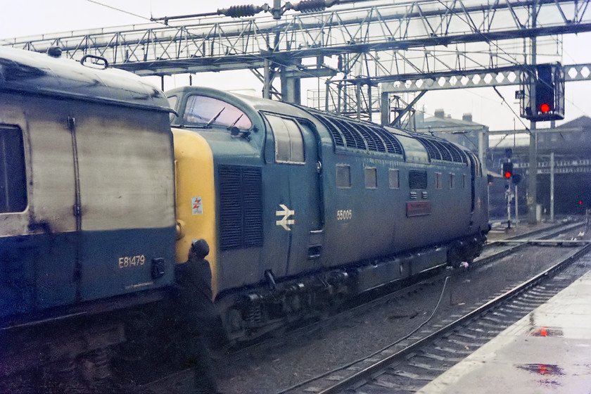 55005, 16.00 London Kings Cross-Edinburgh, The Talisman (1S42), London Kings Cross station 
 At King's Cross, 55005 'The prince of Wales's own regiment of Yorkshire' is attached to stock in the gathering gloom of a miserable February afternoon. The Deltic is going to lead the 16.00 to Edinburgh titled as 'The Talisman'. Notice the total lack of H&S attire worn by the member of staff attending to the coupling of the Deltic, at least he has his BR issues peeked cap on! 
 Keywords: 55005 15.00 London Kings Cross-Edinburgh The Talisman 1S42 London Kings Cross station