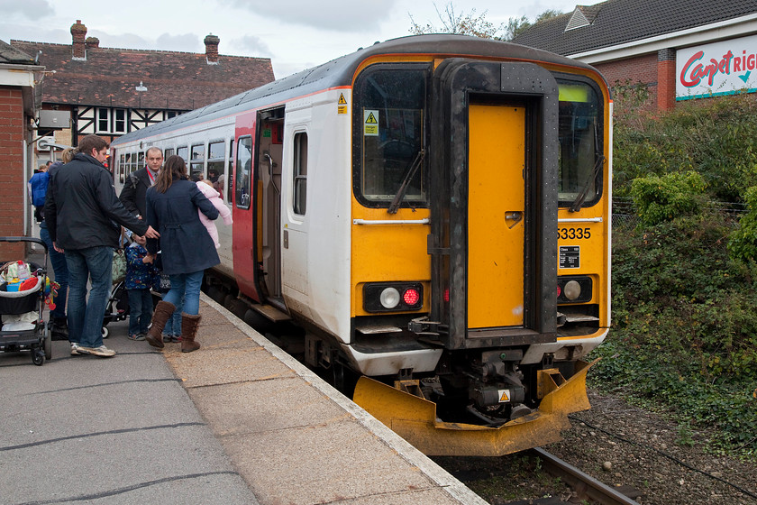 153335. LE 0015.0045 Norwich-Sheringham (0002S0024), Cromer station 
 Our train back from Norwich waits at Cromer station. Here the crew change ends for it make the final part of its journey along the north Norfolk coast to Sheringham. Single-car 153335 was distinctly over-crowded working this 15.45 Norwich to Sheringham service, particularly due to the large number of school pupils who used the train. 
 Keywords: 153335 15.45 Norwich-Sheringham 2S24 Cromer station