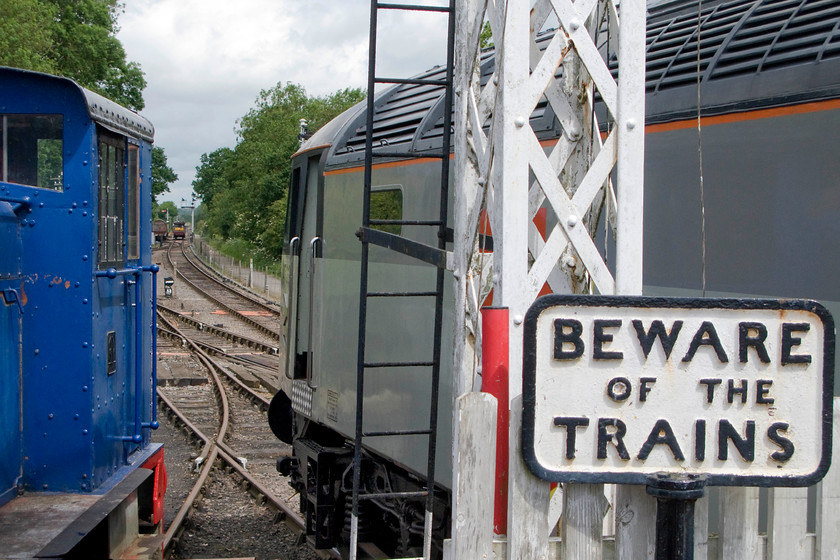 764 & 47205, stabled, Pitsford & Brampton station 
 Looking north from the platform end at Pitsford and Brampton station reveals the line extending over bridge thirteen and to the limit of the line at Merry Tom Lane. To the left is shunter 764 and the right 47205. Both locomotives are serviceable and frequently see use on the line. 
 Keywords: 764 47205 Pitsford & Brampton station Northampton & Lamport Railway NLR