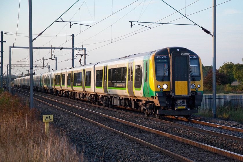 350260, 350370 & 350103, LN 17.14 Rugeley Trent Valley-London Euston (2Y42, 1L), Milton Malsor 
 After a hot day the evening began to cool with some lovely lighting. I went to one of my most favoured local spots at Milton Malsor with my trusty ladder to elevate me above the palisade fencing. 350260, 350370 and 350103 work the 17.14 Rugeley Trent Valley to Euston train. It is likely that only 350103 started out from Rugeley joining the other two units at Birmingham New Street. Notice that this three-set train is composed of a representative of each of the class 350 sub sets. 
 Keywords: 350260 350370 350103 17.14 Rugeley Trent Valley-London Euston 2Y42 Milton Malsor