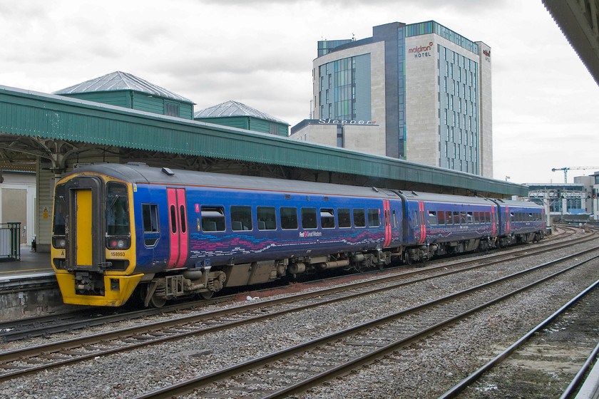 158950, GW 13.30 Cardiff Central-Portsmouth Harbour (1F19), Cardiff Central station 
 Looks can be deceiving, despite the cloudy conditions at Cardiff it was actually a pretty hot day. 158950 waits in the humid conditions with the First Great Western 13.30 to Portsmouth Harbour. I like these units that are basically a Mk. III coach with an engine underneath. They have inherited many of the features of the stock and are good trains. 
 Keywords: 158950 13.30 Cardiff Central-Portsmouth Harbour 1F19 Cardiff Central station First Great Western