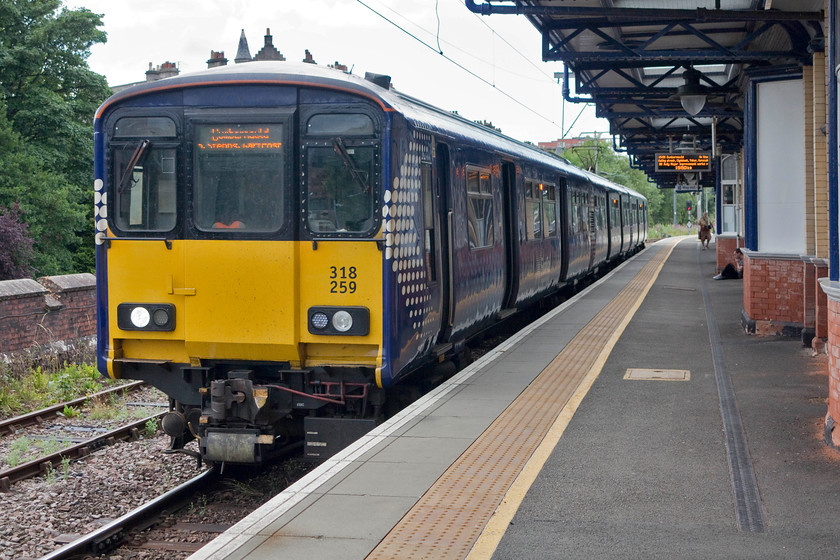 318259, SR 15.56 Dumbarton Central-Cumbernauld (2V62, 3L), Dumbarton Central station 
 318259 stands at Dumbarton Central waiting to work the 15.56 to Cumbernauld. Andy and I took this train all the way to its destination. This took an interesting route right through the middle of Glasgow, stopping at Queen Street Low Level and included a reversal at Springburn. Whilst basic, these 318s appear to do the job that they were designed for well. 
 Keywords: 318259 2V62 Dumbarton Central station