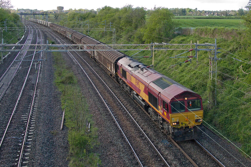 66006, 11.15 Ditton Foundry-Dollands Moor (6026, 6E), Victoria bridge 
 Unbelievably, since its delivery to the UK in 1998 this appears to be my one and only photograph of 66006! When I get a spare hour or so I really must search through my archive and tick off those photographed on a complete list of the class. Still fully EWS liveried and branded 66006 leads the 11.15 Ditton Foundry to Dollands Moor service past Victoria bridge just south of the Northamptonshire village of Roade. 
 Keywords: 66006, 11.15 Ditton Foundry-Dollands Moor (6026, 6E), Victoria bridge