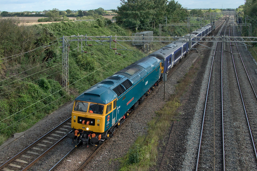 47749, 360120 & 47727, 11.21 Ilford EMUD-Northampton EMD (5Q60, 1E), Victoria bridge 
 47749 'City of Truro' leads the 11.21 Ilford EMU depot to Northampton Kingsheath 5Q60 past Victoria bridge just south of Roade. The veteran Class 47 is towing former Greater Anglia 360120 to the Siemens' depot at Northampton for modifications to enable 110mph running and further use on the electrified MML route between St. Pancras and Corby. 47727 'Edinburgh Castle/Caisteal Shun Eideann' is on the rear of the train. 
 Keywords: 47749 360120 47727, 11.21 Ilford EMUD-Northampton EMD5Q60 Victoria bridge City of Truro Edinburgh Castle Caisteal Shun Eideann