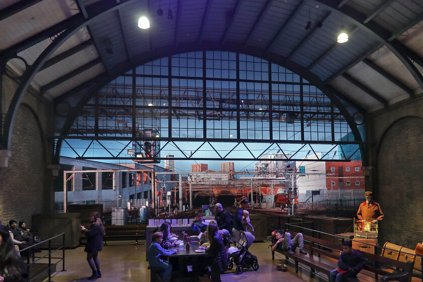 Reproduction of London King's Cross, Harry Potter World 
 Taken inside Warner Bros. studios King's Cross mock-up station reveals a non-authentic roof but the huge projected image at the far end is the genuine article! Looking at the building under construction to the left, which is now complete, dates this image to somewhere about 2017. Notice the stabled Class 67 Thunderbird to the right. 
 Keywords: Reproduction of London King's Cross Harry Potter World