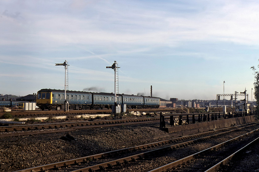 Class 127 DMU, 13.05 London St. Pancras-Bedford, Brent yard 
 With its four Rolls-Royce C8NFLH engines producing a clear trail of exhaust, a class 127 Bed-Pan DMU accelerates away from its stop at Cricklewood station forming the 13.05 St. Pancras to Bedford service. These units operated on this line throughout their entire life, one of the most intensive ones that absolutely wore these units out prior to their delayed withdrawal in 1984 with one or two living on being re-used, for example as parcel carrying units. 
 Keywords: Class 127 13.05 London St. Pancras-Bedford Brent yard