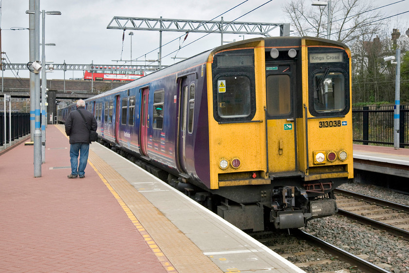 313038 & 313032, GN 08.59 Welwyn Garden City-London King's Cross (2Y19), Alexandra Palace station 
 Having just witnessed 46233 'Duchess of Sutherland' pass Alexandra Palace I had to head back to Central London hoping that my wife and son, who I left sleeping earlier on, were up and ready for the day! I took 313038 and 313032 back to King's Cross as the 2Y19 08.59 from Welwyn Garden City to then take the tube from there. A fellow enthusiast is seen on the platform who had also turned up for the steam charter who also joined this train. 
 Keywords: 313038 313032 08.59 Welwyn Garden City-London King's Cross 2Y19 Alexandra Palace station Great Northern