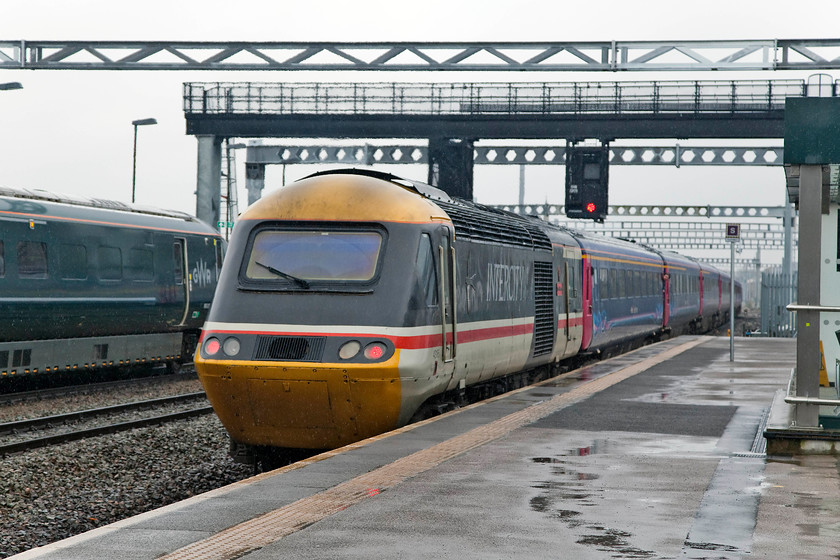 43185, GW 13.36 London Paddington-Cheltenham (1G38, 1L), Swindon station 
 Celebrity Intercity Swallow painted 43185 recently named 'Great Western' brings up the rear of the 13.36 London Paddington to Cheltenham 1G38 working as it leaves Swindon. 43185 was a reasonably late power car introduced to supplement the fleet on the recently introduced north east to south west route in the summer of 1982. To mark the HST 40 celebrations it was give the Intercity Swallow livery that was carried from the early 1990s and put on display at the NRM at York along with 43002 in BR blue on 02.10.16. Incidentally, when first introduced the livery was called 'Intercity Executive' with no side swallow logo. Only later did it become 'Intercity Swallow'....now, where did I leave my anorak? 
 Keywords: 43185 1G38 Swindon station