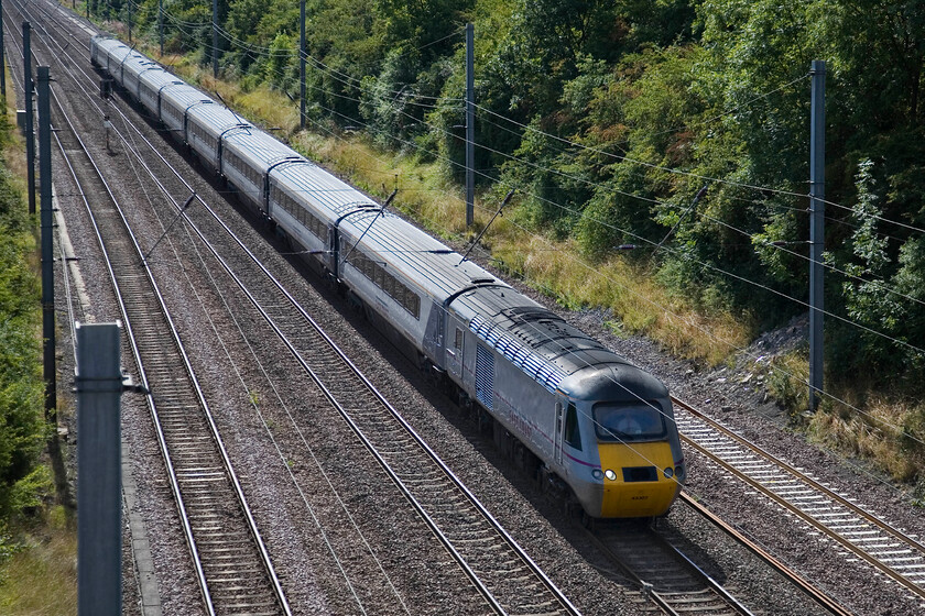 43307, GR 10.00 London King's Cross-Aberdeen, 'The Northern Lights' (1S11), Westby SK96227 
 Led by power car 43307 the 10.00 Kings Cross to Aberdeen HST service approaches the summit of Stoke Bank near the Lincolnshire village of Westby. Whilst East Coast (as part of the National Express empire) has not been particularly successful in recent years at least they have retained some titled trains evoking a past era. This HST service is one of four that the company promote being titled the 'Northern Lights', I was to see one of the others later in the day at Grantham. 
 Keywords: 43307 10.00 London King's Cross-Aberdeen The Northern Lights 1S11 Westby SK96227 East Coast HST