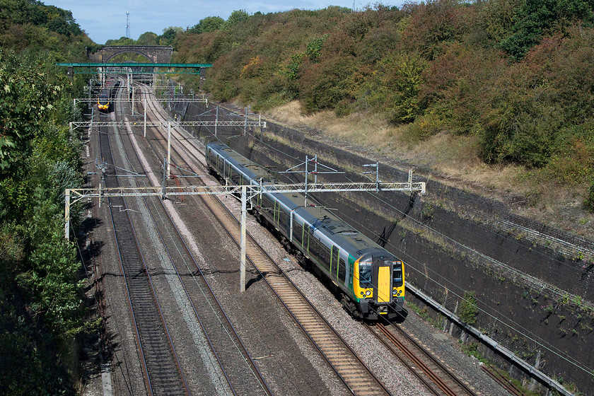 350110, LN 12.26 Northampton-Milton Keynes Central ECS (5K20), Roade Cutting 
 With the autumn colours beginning to emerge at Roade Cutting, 350110 heads south forming the 5K20 12.26 Northampton to Milton Keynes empty stock working. I love the warm lighting of this time of year but do not like the shorter hours of daylight restricting when I can get out to take pictures! 
 Keywords: 350110 5K20 Roade Cutting