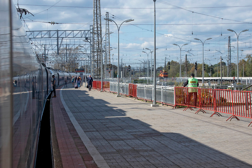 EVS1-12, 13.00 St. Petersburg-Moscow (765A), Bologoye station 
 On the Sapsan route from Moscow to St. Petersburg there are six intermediate stops. However, RZD have adopted a clever stopping pattern where different trains stop at different stations so that they are all served at least three times throughout the day in both directions. Some stations enjoy slightly more stops than others but at least there are no 'stoppers' that pause at all stations thus turning the much heralded rapid service into a slow one. The net result of this is that the fastest Sapsan does the four hundred mile journey in three hours and thirty five minutes making three stops whilst the lowest does it in four hours and four minutes making five stops. Here our ten coach train pauses at Bologoye a town of about twenty thousand people, a significant number of whom work on the railways. It is a major railway hub with a number of main lines crossing in the town that handles passenger and a lot of freight traffic. 
 Keywords: EVS1-12 13.00 St. Petersburg-Moscow 765A Bologoye station