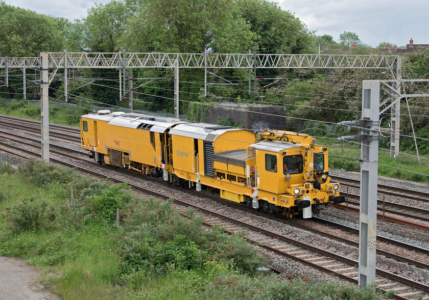 Stoneblower, 10.05 Woking Up Reception-Blackburn Bolton Road (2L), site of Roade station 
 A triumph of function over design is how I would describe the YZA stoneblowers! They undertake a function very similar to tampers by blowing compressed air and ballast (if required) under the track to lift and straighten it. This particular machine, whose number I failed to record, was making the long journey from Woking to Blackburn 
 Keywords: Stoneblower 10.05 Woking Up Reception-Blackburn Bolton Road site of Roade station YZA