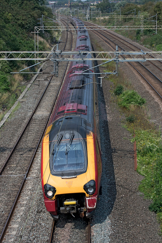 Class 221s, VT 11.50 Birmingham New Street-London Euston (1B15, 6E), Victoria bridge 
 A pair of Avanti West Coast Voyagers make a totally unnecessary journey from Birmingham New Street to Euston. The 11.50 1B15 should not be a diesel unit but an electric; what a total waste of resources. I have asked before but nobody can ever give me a justification as to why such a service is not formed by a Pendolino? The train is seen about to pass under Victoria bridge just south of Roade. 
 Keywords: Class 221 11.50 Birmingham New Street-London Euston 1B15 Victoria bridge Avantai West Coast Voyager