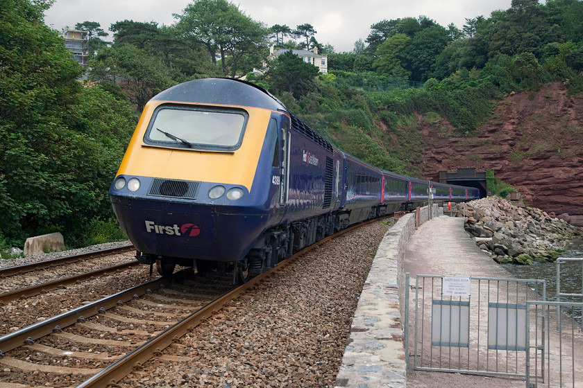 43189, GW 13.05 London Paddington-Plymouth (1C83, RT), Parsons Tunnel 
 43189 'Railway Heritage Trust' leads the 13.05 Paddington to Plymouth HST working along the south Devon sea wall. The train is just emerging from Parsons tunnel about half away along this iconic section of railway. I have always pondered as to whether Parsons Tunnel should be written with an apostrophe. Convention appears that it should not, but I cannot help feeling that it should; thoughts anybody? 
 Keywords: 43189 1C83 Parsons Tunnel Railway Heritage Trust First Great Western HST