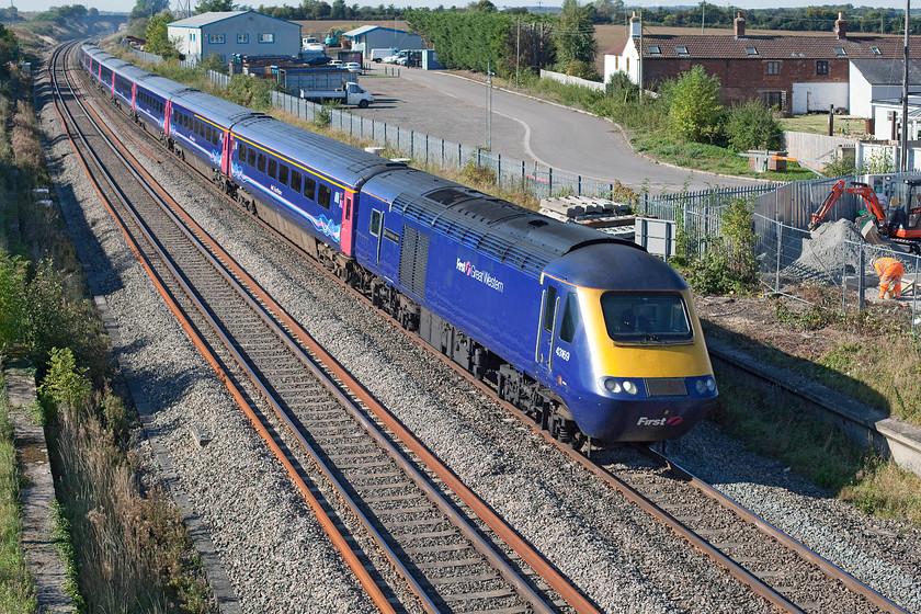 43169 & 43056, GW 10.28 Swansea-London Paddington (via Gloucester) (1L54), site of Shrivenham station 
 43169 'The National Trust' leads the 10.28 Swansea to Paddington past Shrivenham in west Oxfordshire with 43056 'The Royal British Legion' at the rear. Notice some contractors working in a compound area to the right laying a solid and large concrete floor. I suspect that this is in preparation for the forthcoming and hopelessly delayed electrification programme. 
 Keywords: 43169 43056 10.28 Swansea-London Paddington via Gloucester 1L54 site of Shrivenham station