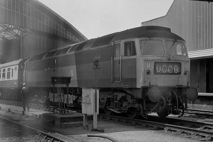 Class 47 (green), unidentified up working, Bristol Temple Meads station 
 You can see that this negative has been fogged, so I would not have bothered to scan it but for its rarity value. Firstly, the class 47 is in BR dual green, there were very few around by the summer of '77. Secondly, observant ones will notice that it's on one of Temple Meads' centre roads. My notes do not reveal the 47s number (arghhh!) or the working. Any information gratefully appreciated. Just a technical point. This negative was so bad when I first looked at it that it was never actually printed. The left hand side was so burnt out it showed no detail. it's amazing what careful scanning and use of Photoshop can do to what was, initially, a throw-away image by bringing back a lot of the hidden detail.