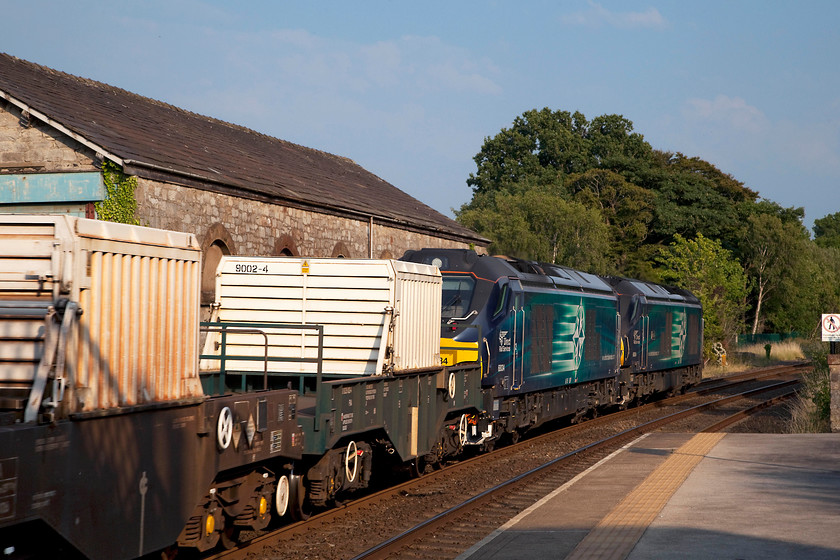 68034 & 68004, 17.38 Sellafield B.N.F.-Crewe Coal Sidings (6K73), Cark station 
 The one that nearly got away! If it not been for a HGV learner driver getting his truck stuck in Cark's Market Street then Andy and I would have arrived at Cark and Cartmel station in time to get a proper shot of this working! However, a going-away shot has the sun in the right position so it's not all bad! 68034 and 68004 'Rapid' speed through the station working the 17.38 Sellafield to Crewe Yard empty nuclear flask train. 
 Keywords: 68034 68004 17.38 Sellafield B.N.F.-Crewe Coal Sidings 6K73 Cark station