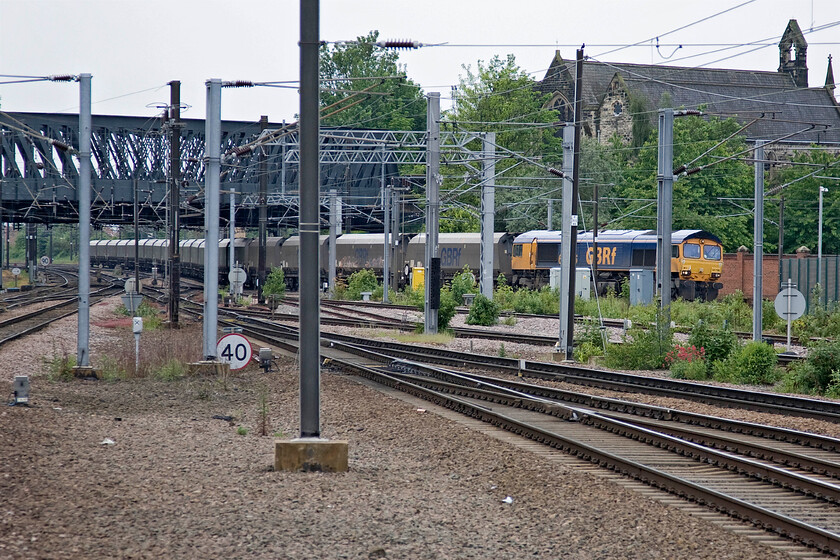 66706, 08.24 Drax PS-Tyne Coal Terminal empty coal train, Yard South Junction (from York station) 
 66706 'Nene Valley' takes the York avoider line leading the 08.24 Drax power station to Tyne Coal Yard empty coal train. The large church of St. Paul's Holgate dominates the skyline along with the famous Holgate bridge that carries the A59 into the city. 
 Keywords: 66706 08.24 Drax PS-Tyne Coal Terminal empty coal train, Yard South Junction York station Nene Valley