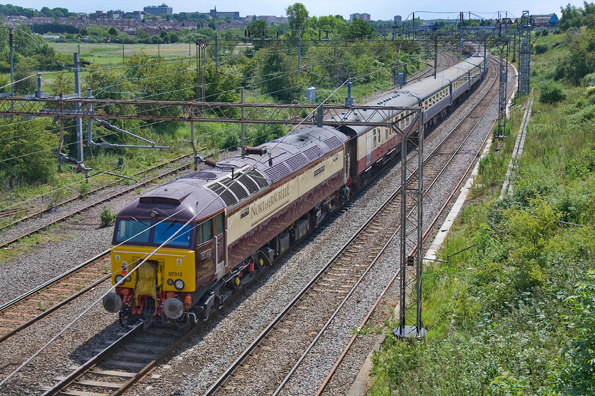 57312, up ecs 10.50 Crewe-London Euston (5Z51), Mill Lane bridge 
 With the buildings of Northampton dominating the skyline, 57312 'Solway Princess' is seen at the rear of the 10.50 Crewe to Euston ecs working in preparation for the Three Peaks Challenge charity event. After taking this picture I hopped back in the work's van and returned for a busy afternoon in the workshop. However, on such a lovely June afternoon, I know where I'd rather be! 
 Keywords: 57312 ecs 10.50 Crewe-London Euston 5Z51 Mill Lane bridge Northampton Solway Princess Northern Belle