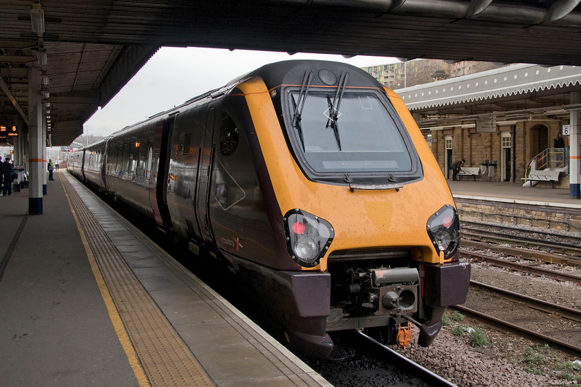 221137, XC 11.47 Southampton-Newcastle (1E44, 8L), Sheffield station 
 Having arrived from the south, 221137 pauses at Sheffield station with the 11.47 Southampton to Newcastle. Despite it coming up for twelve years since Virgin relinquished the franchise to Arriva, the outline of the Virgin crest can still be made out on the yellow nose cone. Does this really mean that the fronts of these Voyagers have not received any fresh paint in that time? 
 Keywords: 221137 11.47 Southampton-Newcastle 1E44 Sheffield station