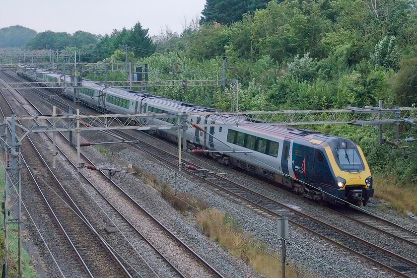 221102 & 221109, VT 08.16 London Euston-Birmingham New Street (9G08, 9L), Victoria bridge 
 Could this one be my LAST picture of a Voyager? Probably not as the rollout of the Class 805s has proved, rather inevitably, slower than anticipated. I am now reading that squadron service for the Everos could be the start of 2025 as they are experiencing some issues pertaining to the doors - where have we heard that before? In the meantime, 221102 and 221109 pass Victoria bridge near Roade working the 08.16 Euston to Birmingham New Street service. 
 Keywords: 221102 221109 08.16 London Euston-Birmingham New Street 9G08 Victoria bridgeVirgin Voyager