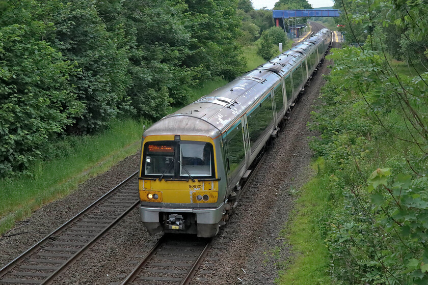 168002 & 168112, CH 06.43 Birmingham Moor Street-London Marylebone (1H14, 1E), King's Sutton SP494358 
 Chitern's 168002 and 168112 pass through the dull Northamptonshire countryside just a short distance south of King's Sutton station working the 06.43 Birmingham Moor Street to Marylebone service. Whilst this spot is in my home county it is only just so with the county boundary with Oxfordshire just behind the trees to the left following the meandering River Cherwell. 
 Keywords: 168002 168112 06.43 Birmingham Moor Street-London Marylebone 1H14 King's Sutton SP494358 Chiltern Railways Turbo