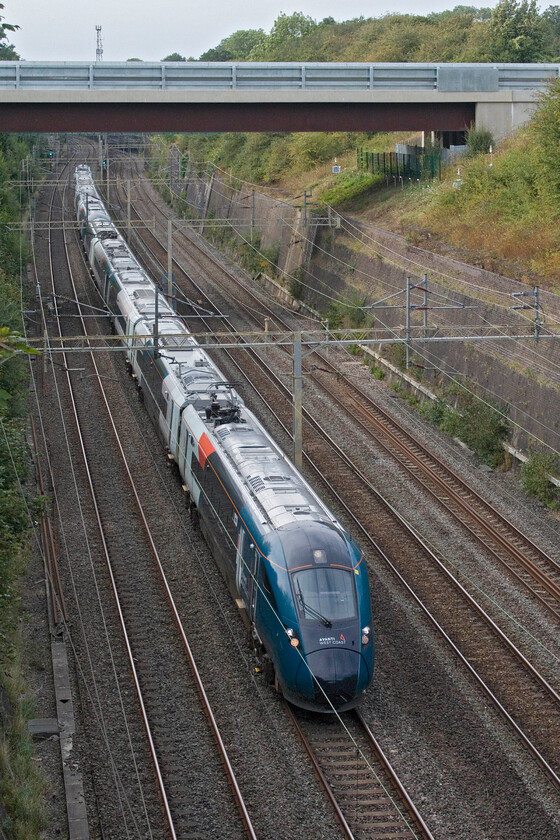 805009 & 805003, VT 16.21 Birmingham New Street-London Euston (1B52, 7L), Roade cutting 
 I don't wish to tell AWC Control how to run their trains but I have a question. A few minutes before this image was taken, a pair of old, dirty and noisy Class 221s headed south through Roade cutting on a Chester to Euston service. Now 805009 and 805003 head south with the 16.21 Birmingham to Euston service. Why roster the 221s on the Chester train and the 805s on the Birmingham one? 
 Keywords: 805009 805003 16.21 Birmingham New Street-London Euston 1B52 Roade cutting Avanti West Coast Evero